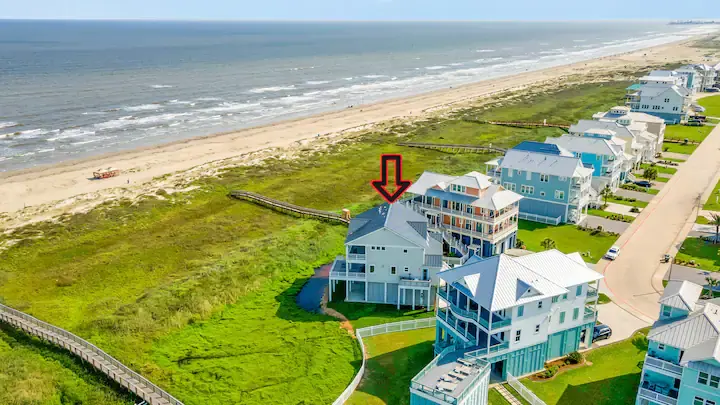 Aerial of the beachfront row with dunes and shoreline surrounding Fishwife