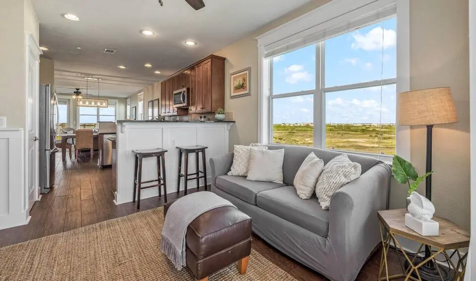 Kitchen bar seating and sitting area at Top-Floor Condo at Pointe West