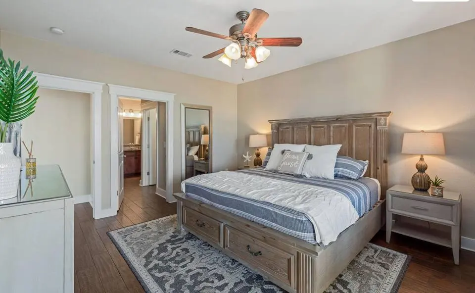 Bedroom with wood bed frame and two nightstands at Top-Floor Condo at Pointe West